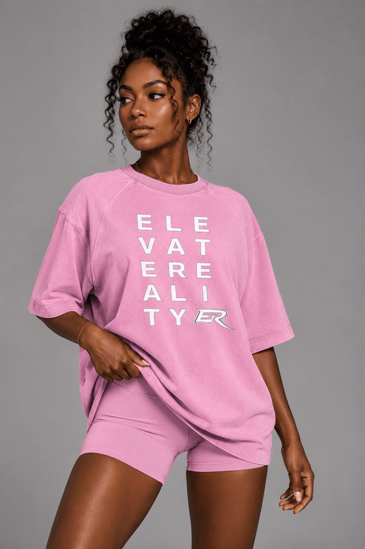 Woman wearing matching pink Short Sleeve Pump Cover and athletic shorts set front view