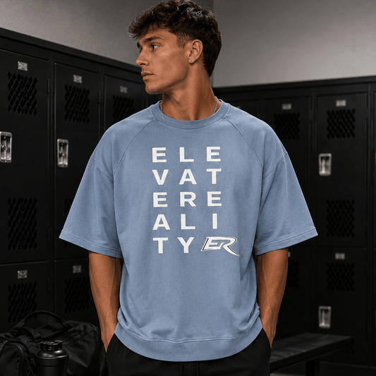 Man wearing light blue heavy cotton Short Sleeve Pump Cover with block letter logo graphic in gym locker room