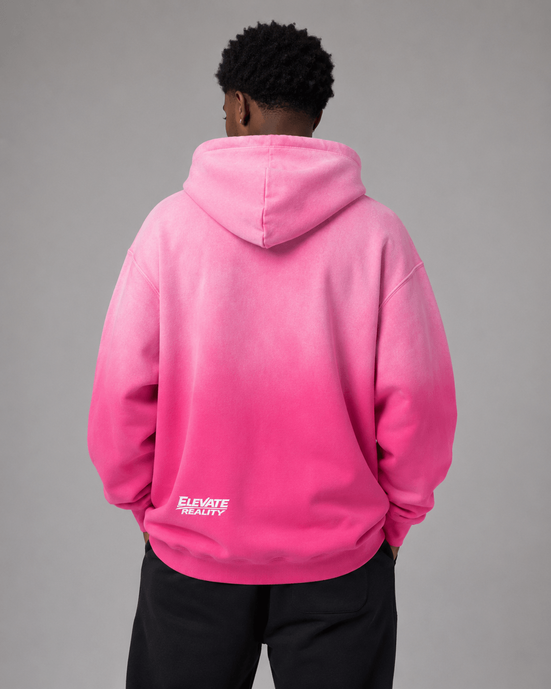 Unisex loose fit pink sunfade hoodie back view styling for street fashion